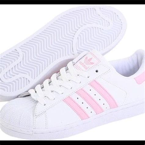 white Adidas with pink stripe